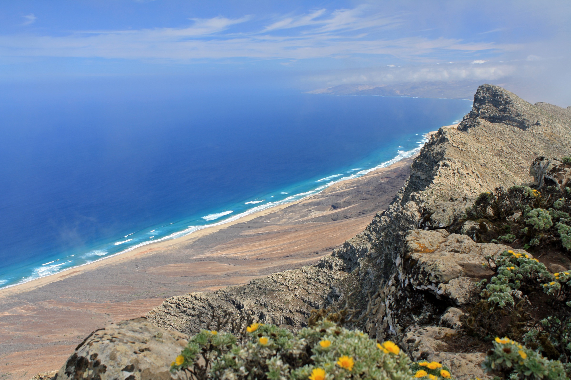 View from the summit of Pico de la Zarza looking down over Cofete Beach and the wild Jandía coastline