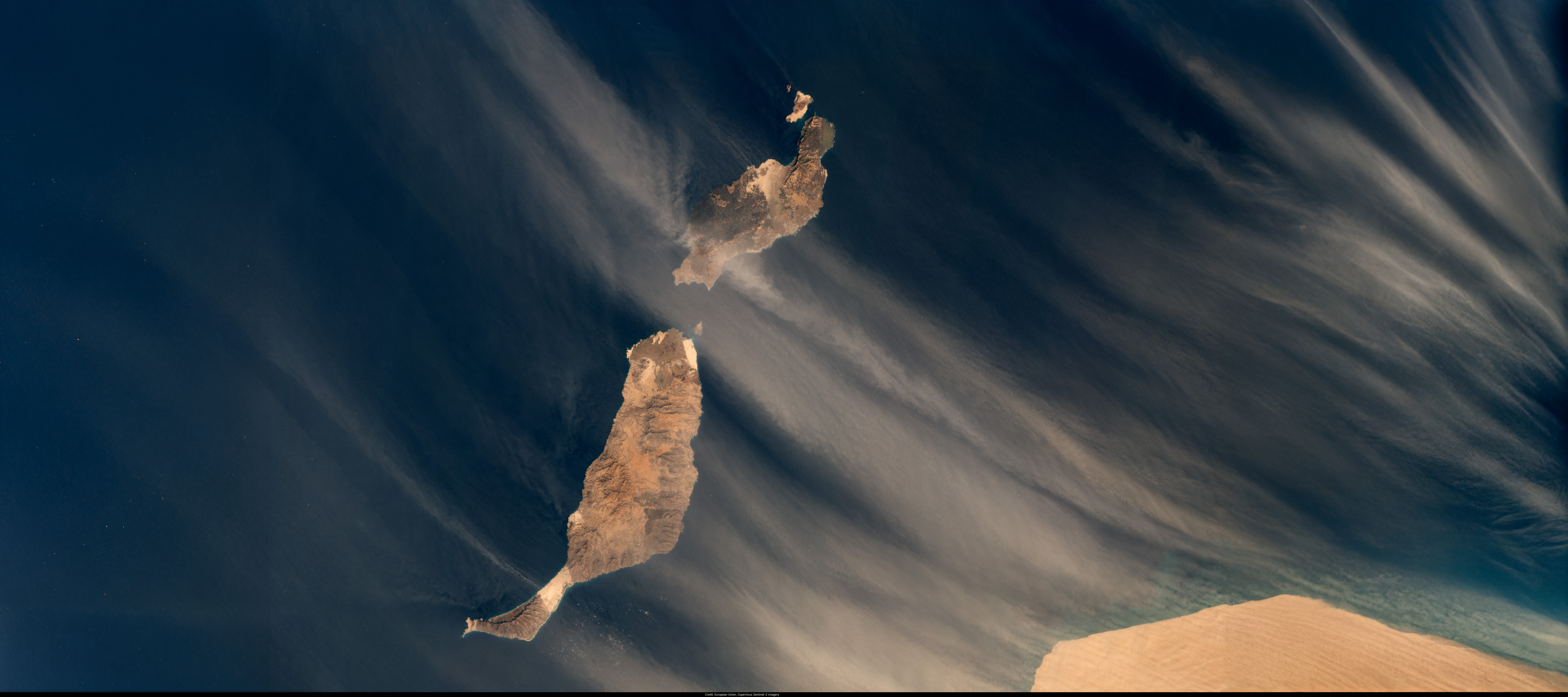 Satellite image of Fuerteventura and Lanzarote during a Calima event, with Saharan dust streaming across the Atlantic